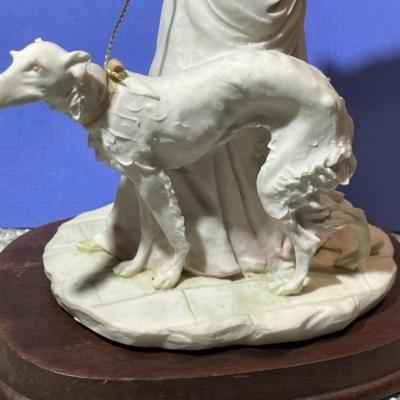 Vintage Arnart Pucci Porcelain Victorian Lady Walking Dog Figurine on Attached Wooden Base in VG Condition.