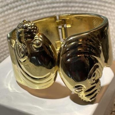 Ladies Hinged Gold-tone Color Sea Lion Fashion Spring Loaded Cuff Bracelet 1"-1.5" in VG Preowned Condition.