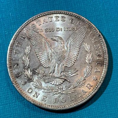 1885-O BU CONDITION MORGAN SILVER DOLLAR AS PICTURED.