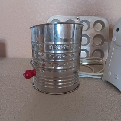 KITCHEN AID HAND MIXER, ELECTRIC CAN OPENER, FLOUR SIFTER AND SMALL MUFFIN PANS