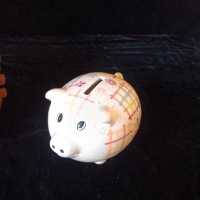 LOG CABIN COIN BANK AND A PIGGY BANK