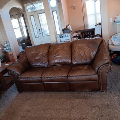 LEATHER RECLINING SOFA AND LOVESEAT WITH NAILHEAD ACCENTS