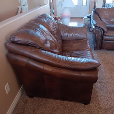 LEATHER RECLINING SOFA AND LOVESEAT WITH NAILHEAD ACCENTS