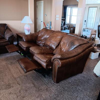 LEATHER RECLINING SOFA AND LOVESEAT WITH NAILHEAD ACCENTS