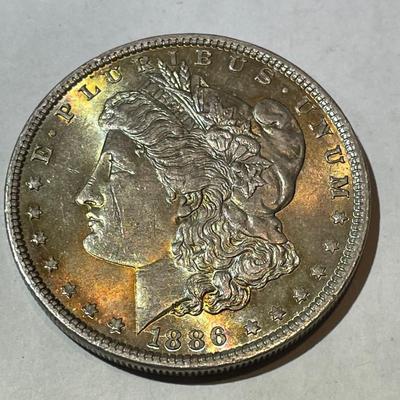 1886-P NICE ORIGINAL TONED UNCIRCULATED MORGAN SILVER DOLLAR AS PICTURED.