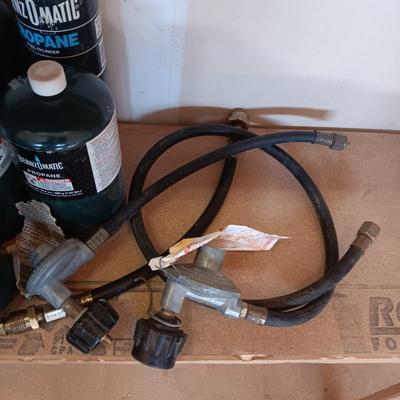 PROPANE CANS AND PRESSURE REGULATORS