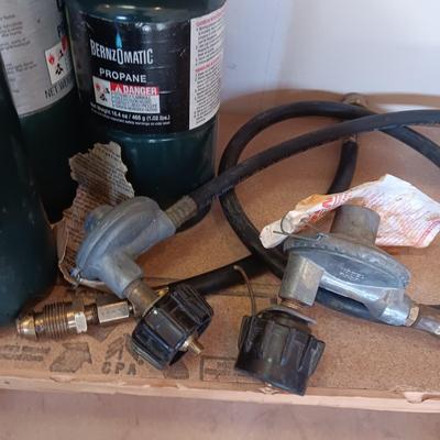 PROPANE CANS AND PRESSURE REGULATORS
