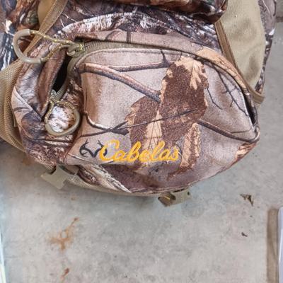 CABELAS CAMO BACKPACK FILLED WITH MANY ESSENTIALS