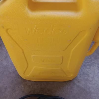 AUTO JUMPER CABLES AND A PLASTIC DIESEL FUEL CARRIER