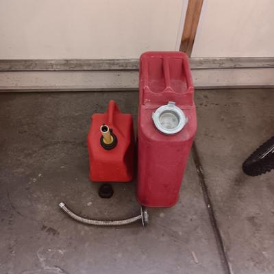 5 GALLON METAL JERRY GAS CAN AND A PLASTIC 2 GALLON CAN