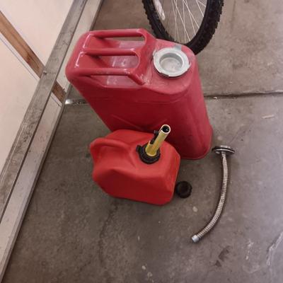 5 GALLON METAL JERRY GAS CAN AND A PLASTIC 2 GALLON CAN