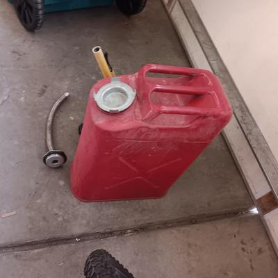 5 GALLON METAL JERRY GAS CAN AND A PLASTIC 2 GALLON CAN