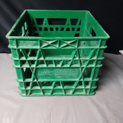 HEAVY PLASTIC MILK CRATE AND A METAL FIRST-AID KIT WITH SOME CONTENTS