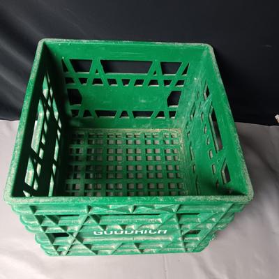 HEAVY PLASTIC MILK CRATE AND A METAL FIRST-AID KIT WITH SOME CONTENTS