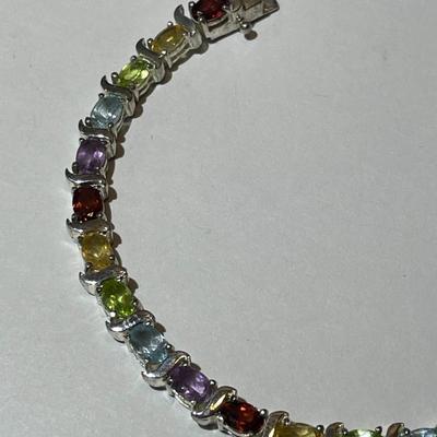 Vintage .925 Sterling Silver Multi-color Stone 7.5" Bracelet in Very Good Preowned Condition.