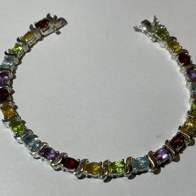 Vintage .925 Sterling Silver Multi-color Stone 7.5" Bracelet in Very Good Preowned Condition.