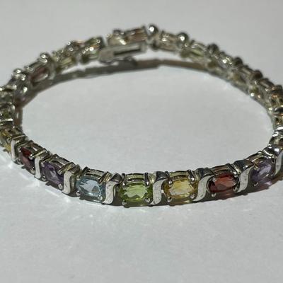 Vintage .925 Sterling Silver Multi-color Stone 7.5" Bracelet in Very Good Preowned Condition.