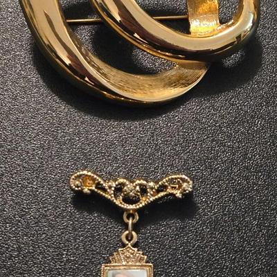 (2) Brooches