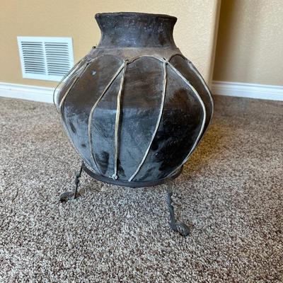 LARGE RAWHIDE BOUND CLAY POT ON IRON STAND