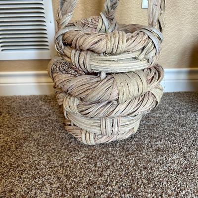 CLAY POT WITH FAUX FOLIAGE AND UNIQUELY WEAVED BASKET