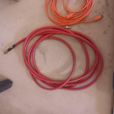 AN ALUMINUM LEVEL, EXTENSION CORD AND AIR HOSE