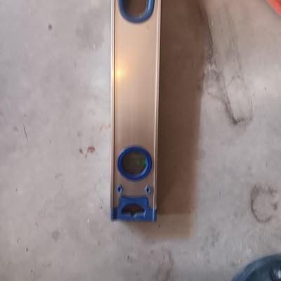 AN ALUMINUM LEVEL, EXTENSION CORD AND AIR HOSE