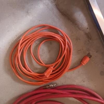 AN ALUMINUM LEVEL, EXTENSION CORD AND AIR HOSE