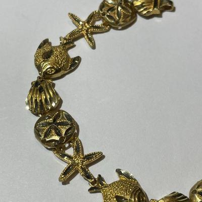Vintage Never Worn 14K Starfish & Sand Dollar Bracelet 7" Weighing 7,5 Pennyweights as Pictured.