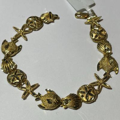 Vintage Never Worn 14K Starfish & Sand Dollar Bracelet 7" Weighing 7,5 Pennyweights as Pictured.