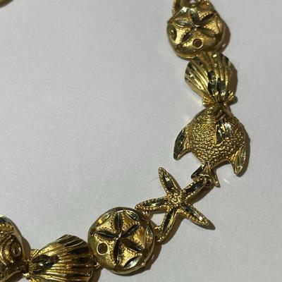 Vintage Never Worn 14K Starfish & Sand Dollar Bracelet 7" Weighing 7,5 Pennyweights as Pictured.