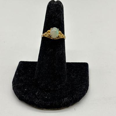Gold toned and opal tones ring