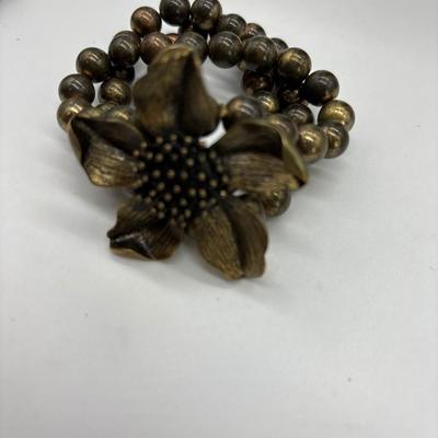 Brown beaded bracelet with flower