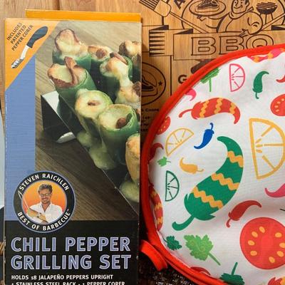 LOT:73: Grilling Must Haves Including Large Wood Cutting/Carving Board, Folding Basket/Cutting Board, Rattan Serving Tray Cookbooks and More
