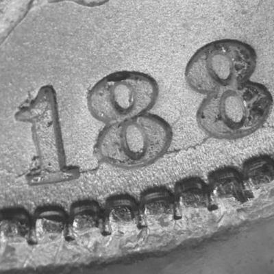 1884-CC Morgan Silver Dollar. VAM-2. Repunched Date, 18/18. MS-63 Condition Uncertified as Pictured.