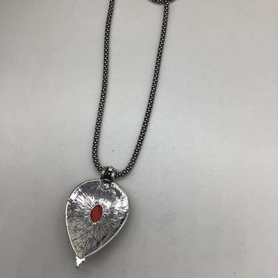 Treyo coral colored pendant necklace