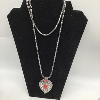 Treyo coral colored pendant necklace