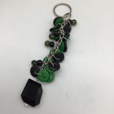 Black and green keychain charm