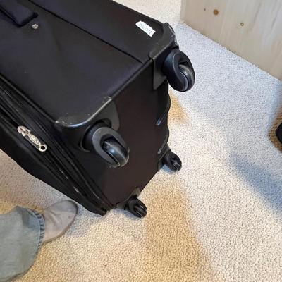 2 black matching suit cases