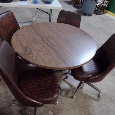 Vintage Mid-Century Laminate Wood Grain Finish Table with Four Rolling Chairs