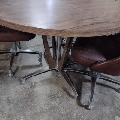 Vintage Mid-Century Laminate Wood Grain Finish Table with Four Rolling Chairs