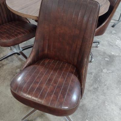 Vintage Mid-Century Laminate Wood Grain Finish Table with Four Rolling Chairs