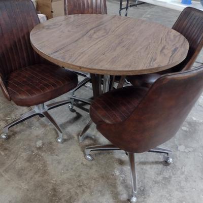 Vintage Mid-Century Laminate Wood Grain Finish Table with Four Rolling Chairs