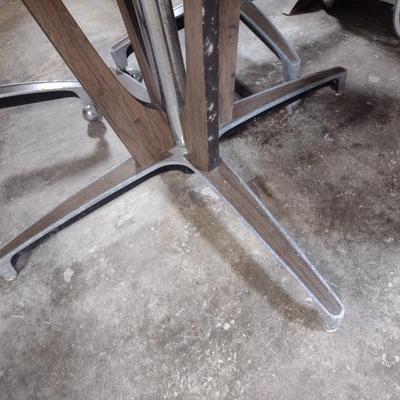 Vintage Mid-Century Laminate Wood Grain Finish Table with Four Rolling Chairs