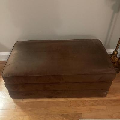 Lazy Boy brown suede storage ottoman. Has rollers for easy movement. 43â€ wide, 25â€ deep, 17â€ high. $75. Excellent condition.