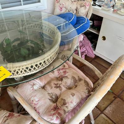 Wicker and glass patio table set