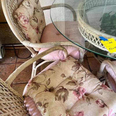 Wicker and glass patio table set