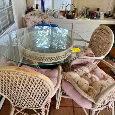 Wicker and glass patio table set