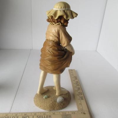 Cute Figurine of Girl at the Beach Gathering Shells