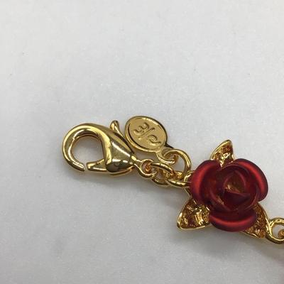 Gold toned bracelet with roses