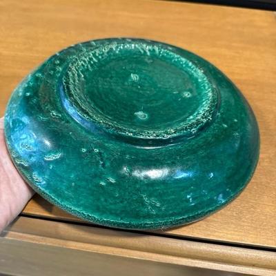 Sale Photo Thumbnail #306: Extremely heavy platter with dark green glaze looks to be very old but needs a proper appraisal and verification of date and time created. Handcrafted and painted with clear indications of somewhat primitive methods potentially significant to age of this 